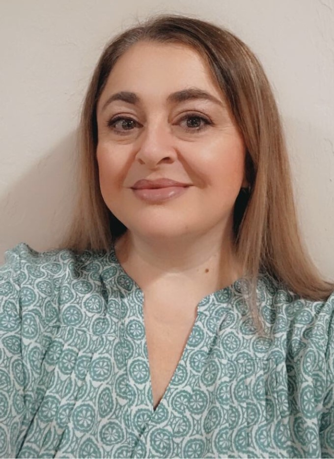 picture of Valerie in front of a blank wall